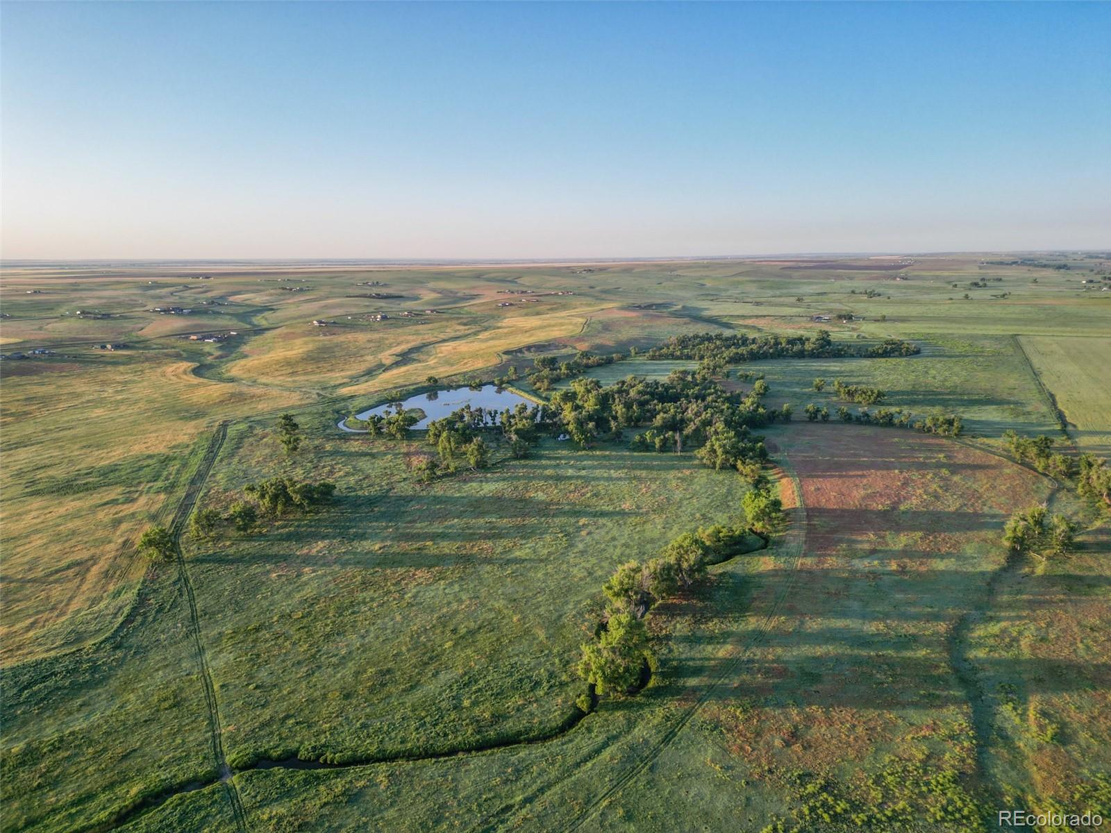 Pass Me By Road Strasburg, CO 80136 - Photo 14 of 46 a view of an ocean and beach