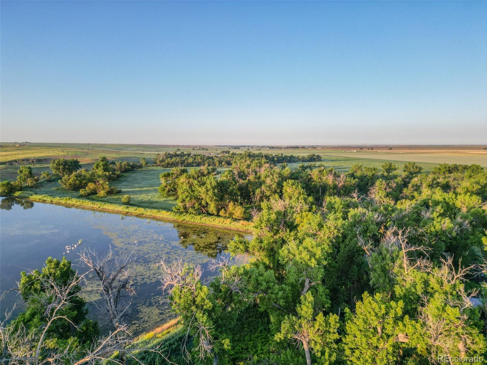 Pass Me By Road Strasburg, CO 80136 - Photo 21 of 46 an aerial view of a city with lots of residential buildings