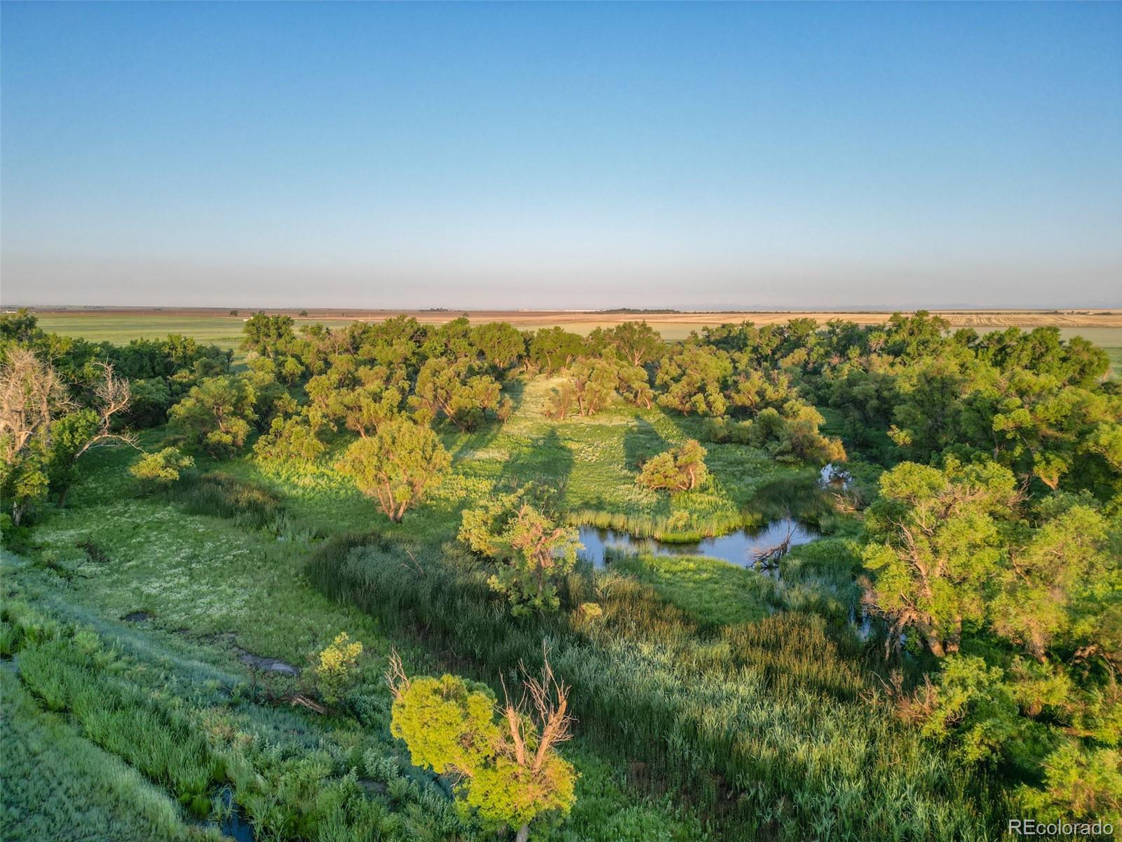 Pass Me By Road Strasburg, CO 80136 - Photo 28 of 46 a view of an outdoor space and a lake view