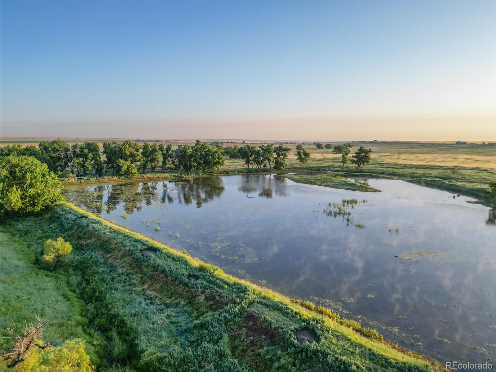 Pass Me By Road Strasburg, CO 80136 - Photo 3 of 46 a view of a lake with a city