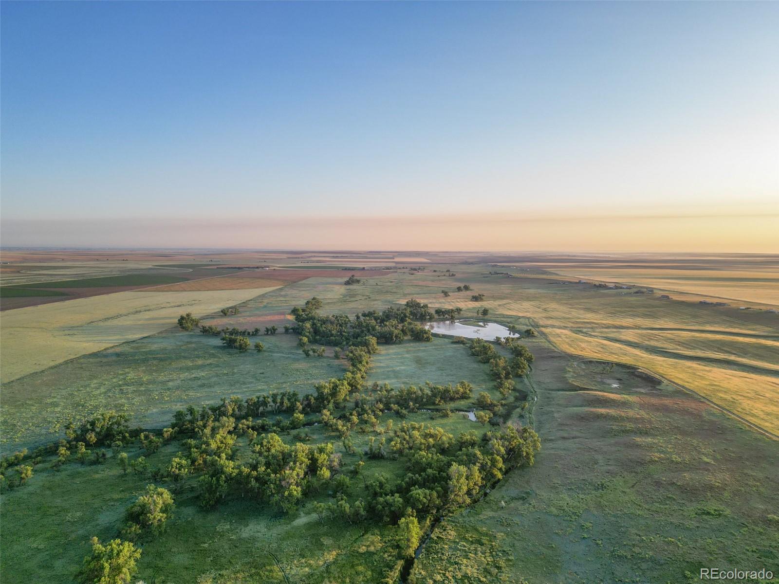 Pass Me By Road Strasburg, CO 80136 - Photo 39 of 46 a view of an ocean and beach