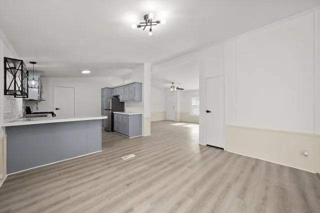 a view of kitchen with wooden floor and window