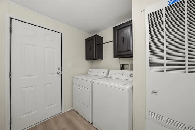 a view of bathroom with a washer and dryer