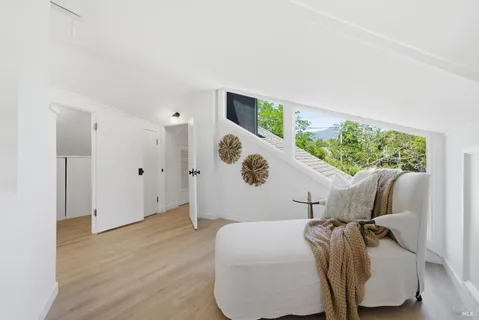 a bedroom with bed and a window