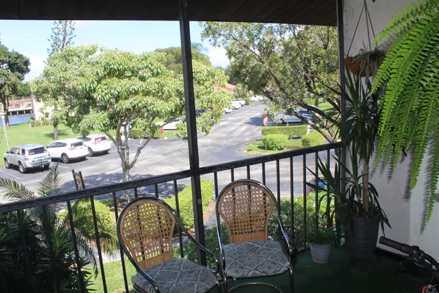 a house that has a tree in front of it
