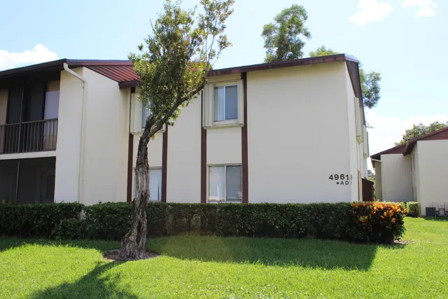 a view of a room with wooden floor and cabinet