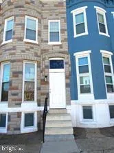 a front view of a brick building with many windows