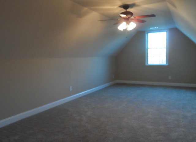 346 Eagle Ridge Road Macon, GA 31216 - Photo 22 of 30 an empty room with a window and a ceiling fan
