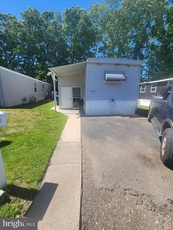 a view of a backyard with a tub and trees