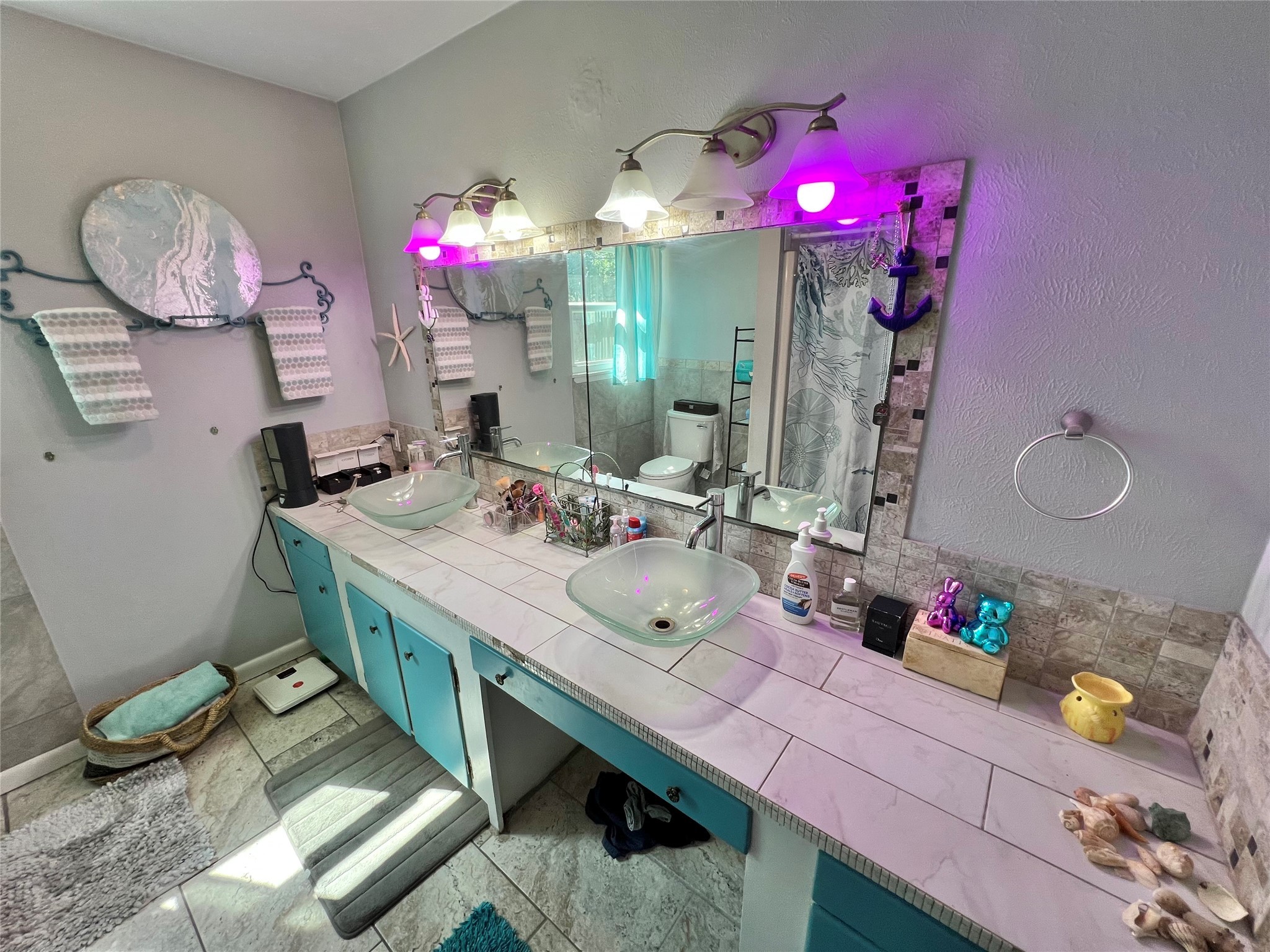 424 Evans Street Angleton, TX 77515 - Photo 16 of 20 a bathroom with a sink vanity mirror and vanity