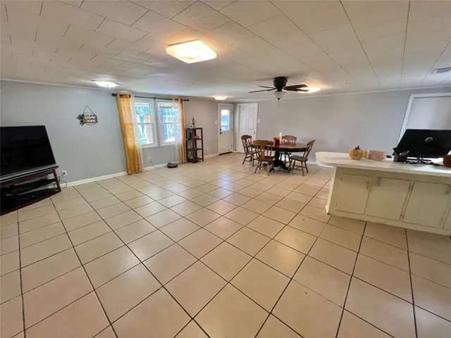 a view of empty room with furniture and natural light