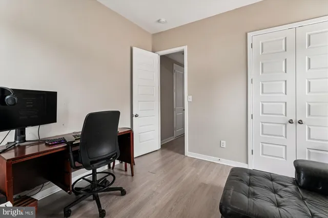 a workspace with furniture and wooden floor