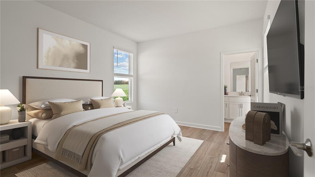 7851 Poplin Street Kissimmee, FL 34747 - Photo 23 of 36 a bedroom with a bed and glass windows