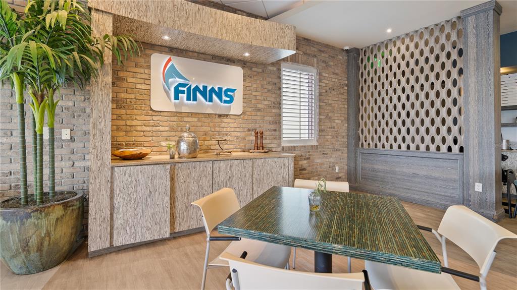 7851 Poplin Street Kissimmee, FL 34747 - Photo 32 of 36 a view of a dining room with furniture and wooden floor