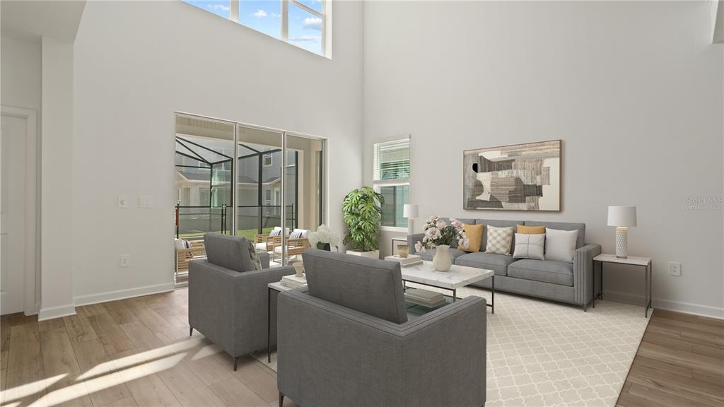 7851 Poplin Street Kissimmee, FL 34747 - Photo 7 of 36 a living room with furniture and a large window