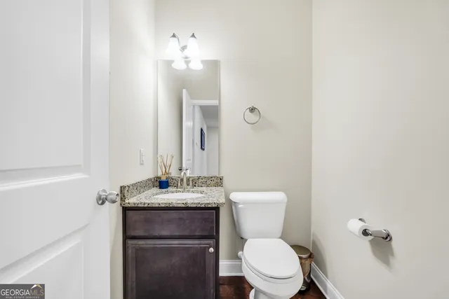 a room with a bed and a ceiling fan