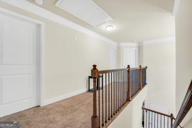 a bedroom with a large bed and a flat screen tv