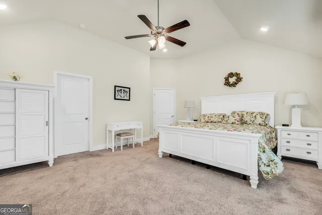 a spacious bathroom with a granite countertop sink and a mirror