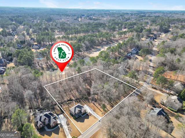 front view of a brick house with a large window
