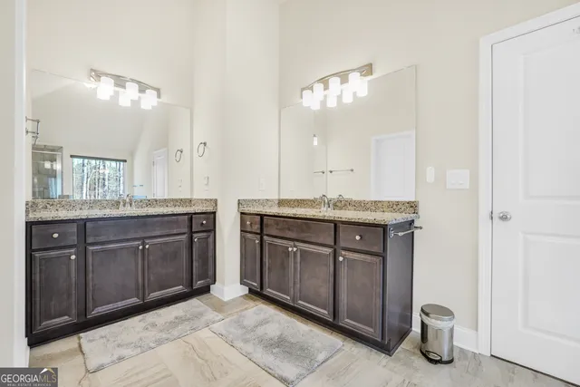 a bedroom with furniture and a flat screen tv