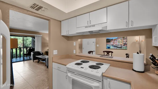 a kitchen with a stove and a refrigerator