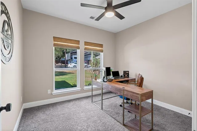 a workspace with furniture and a window