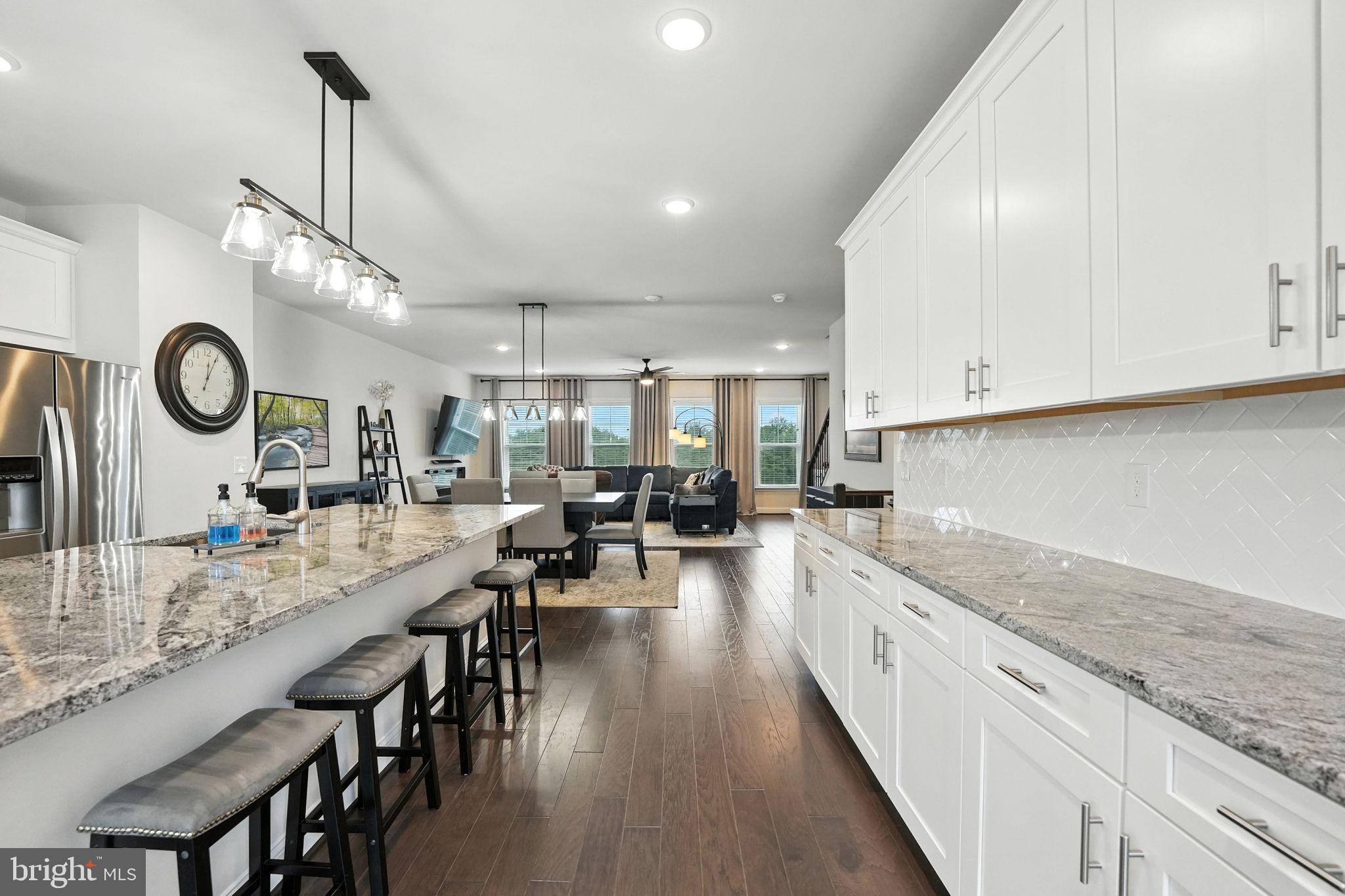 17233 Branched Oak Road Dumfries, VA 22026 - Photo 18 of 79 a large kitchen with lots of counter space a sink and appliances