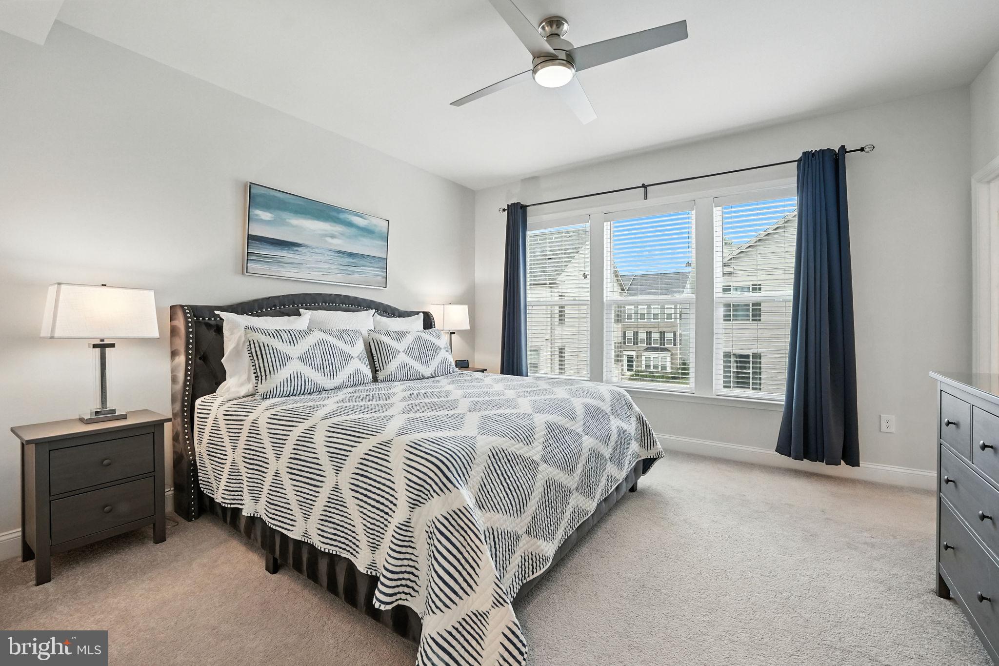 17233 Branched Oak Road Dumfries, VA 22026 - Photo 25 of 79 a bedroom with bed and a large window