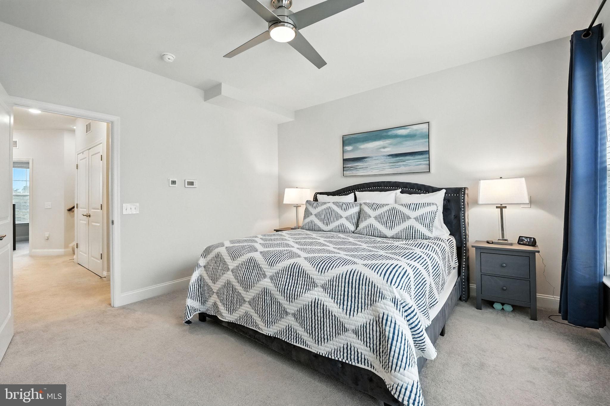 17233 Branched Oak Road Dumfries, VA 22026 - Photo 27 of 79 a bedroom with a bed and painting on the wall