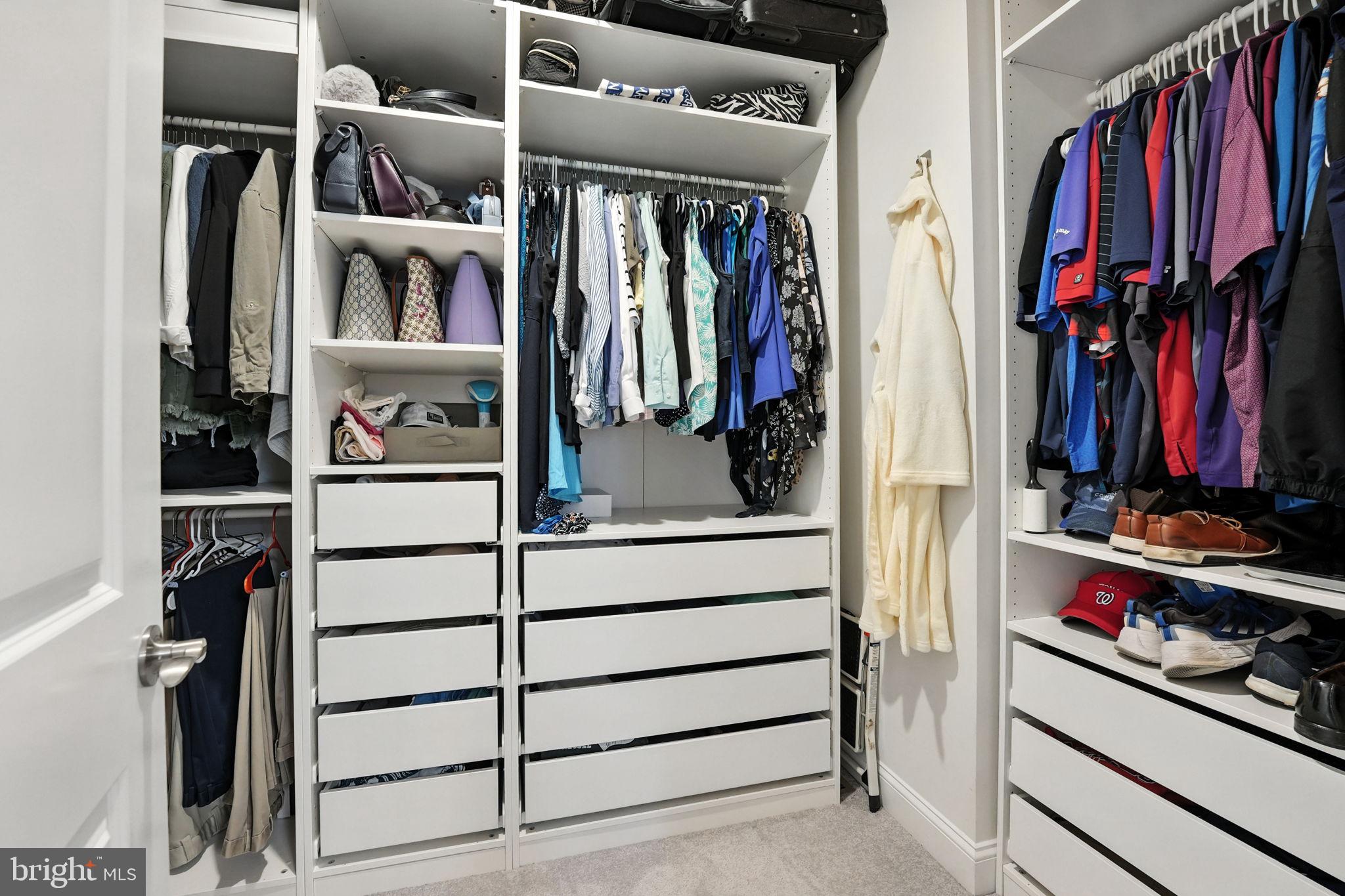 17233 Branched Oak Road Dumfries, VA 22026 - Photo 30 of 79 a view of walk in closet with clothes and shoes