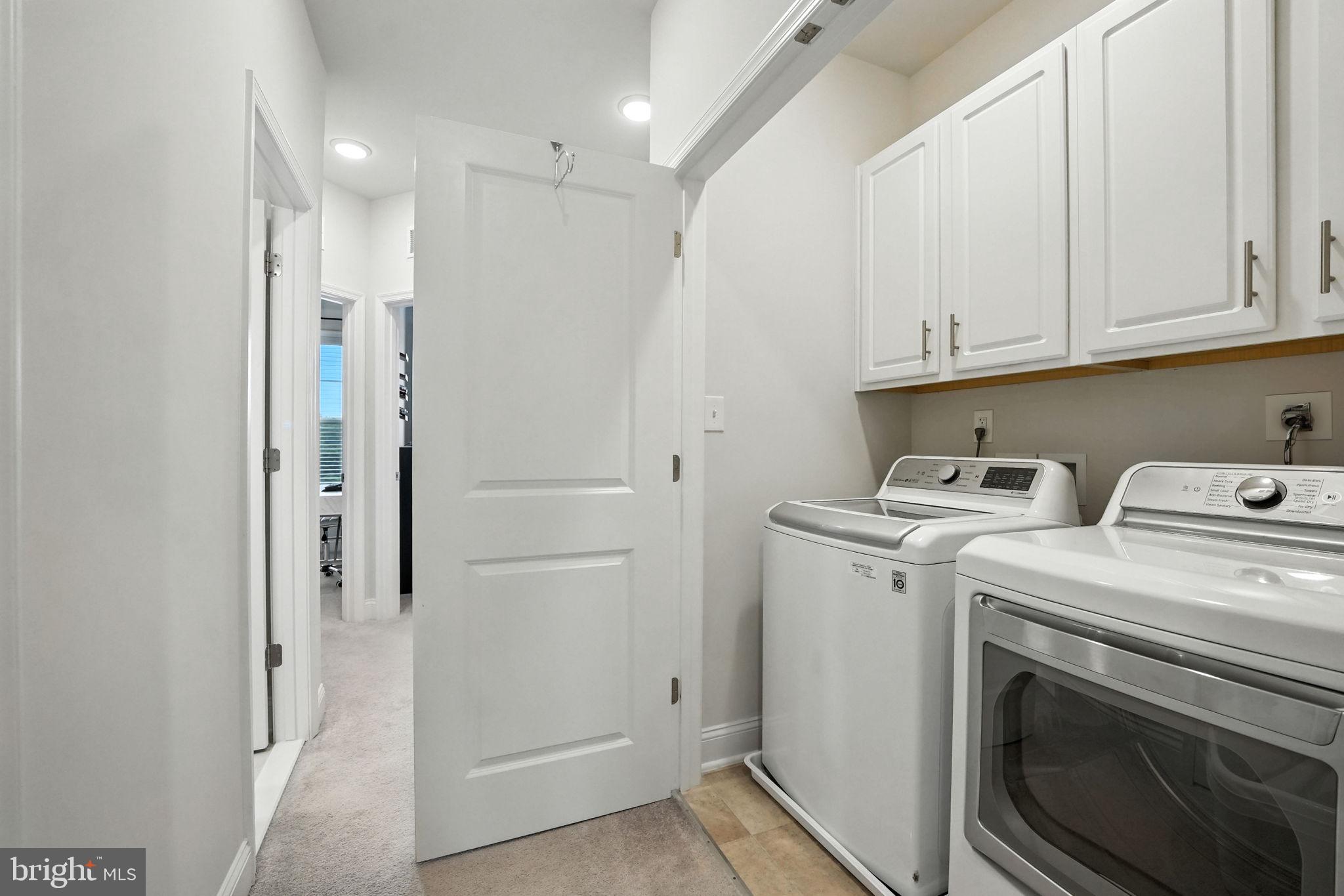 17233 Branched Oak Road Dumfries, VA 22026 - Photo 31 of 79 a view of storage and utility room with washer and dryer