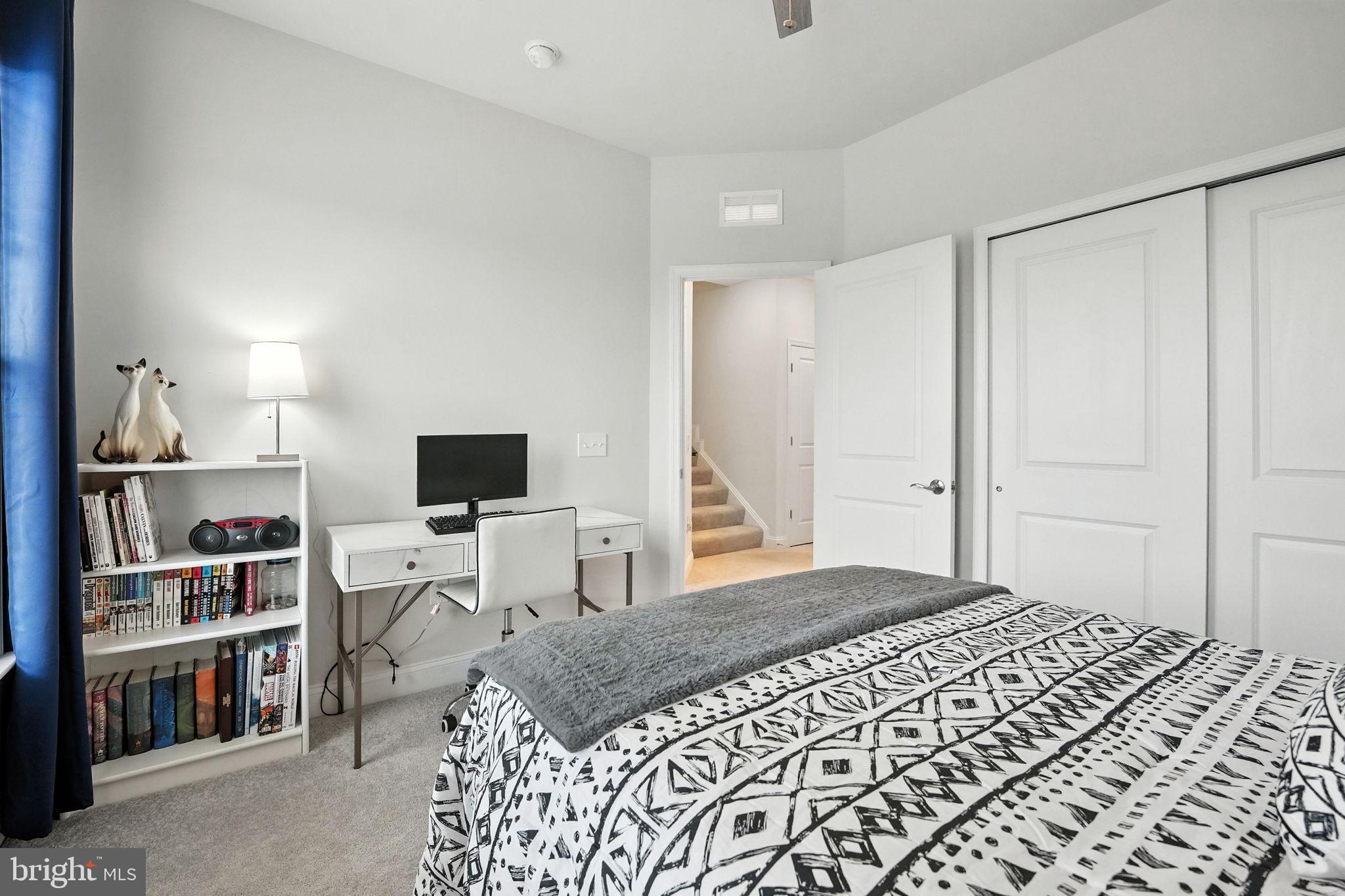 17233 Branched Oak Road Dumfries, VA 22026 - Photo 33 of 79 a bedroom with a bed and a flat screen tv