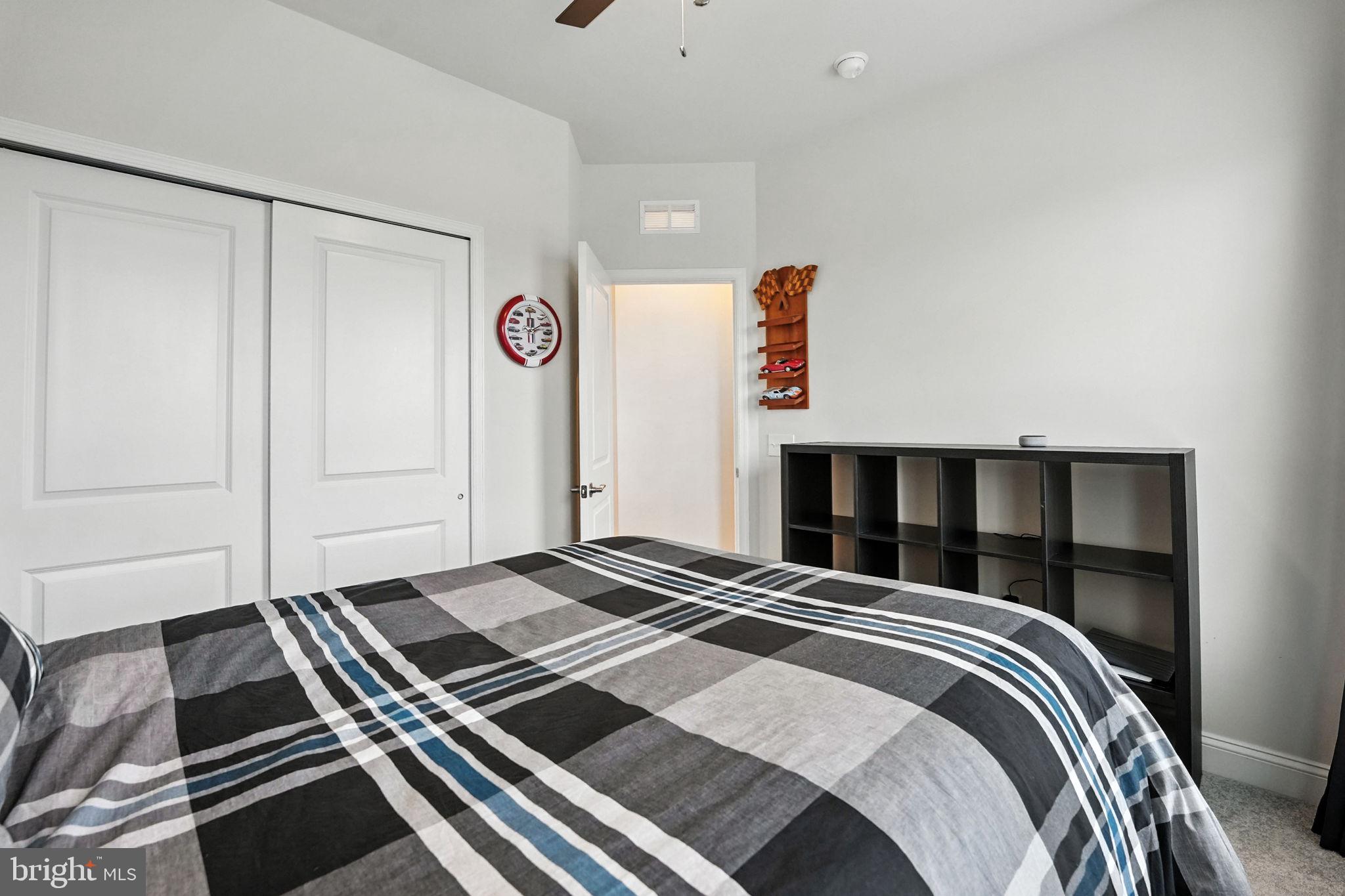 17233 Branched Oak Road Dumfries, VA 22026 - Photo 36 of 79 a bedroom with a bed and a window