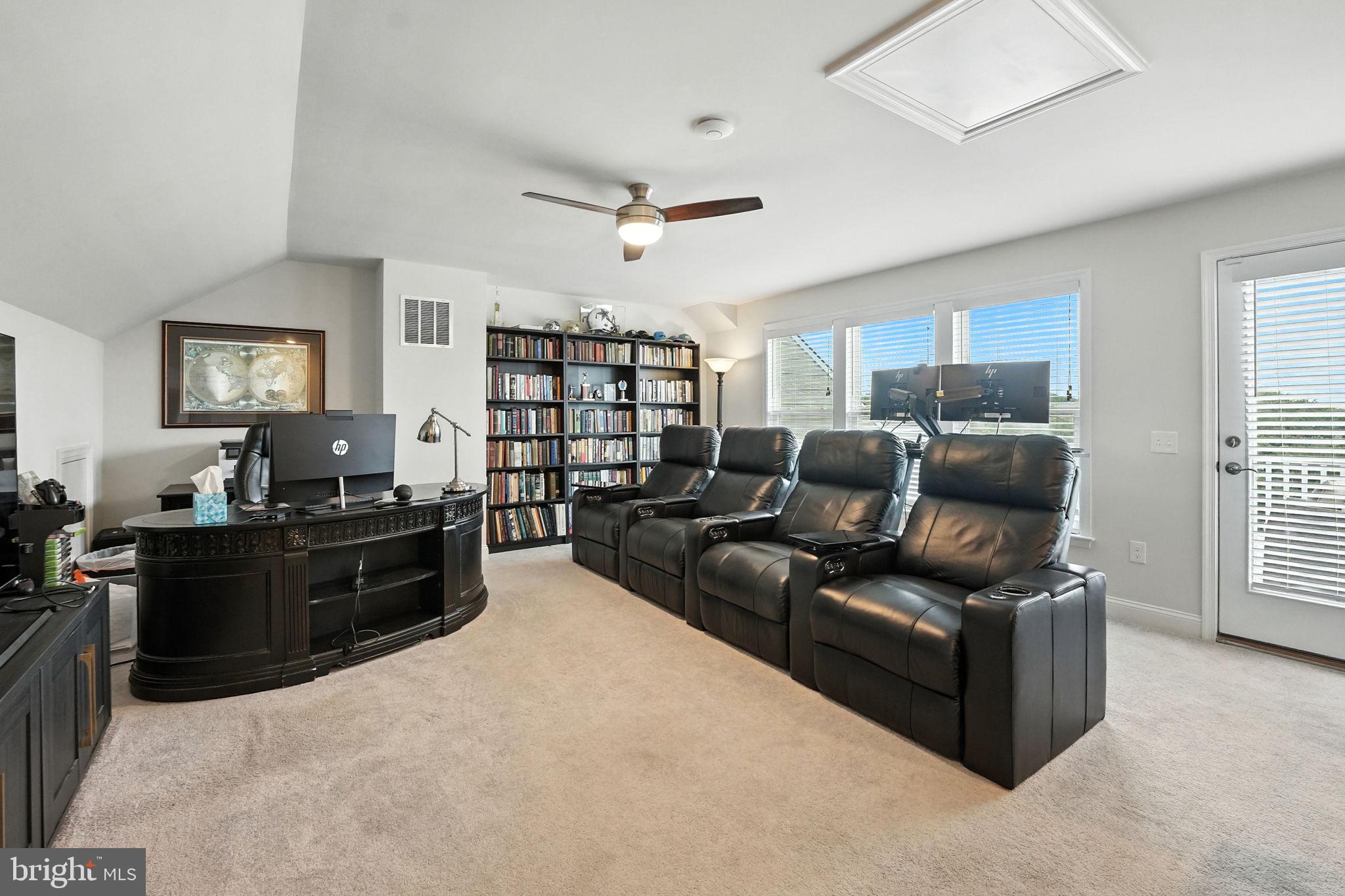 17233 Branched Oak Road Dumfries, VA 22026 - Photo 39 of 79 a living room with furniture and a flat screen tv