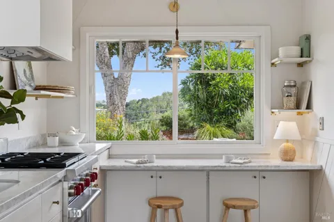 a kitchen with a sink a counter and cabinets