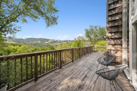 a view of balcony with furniture