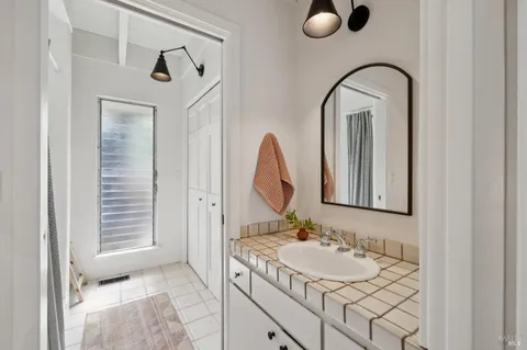 a bathroom with a sink and a mirror