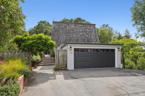 a front view of a house with a garage