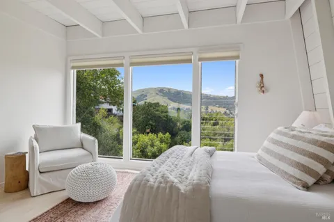 a bedroom with a bed and a couch