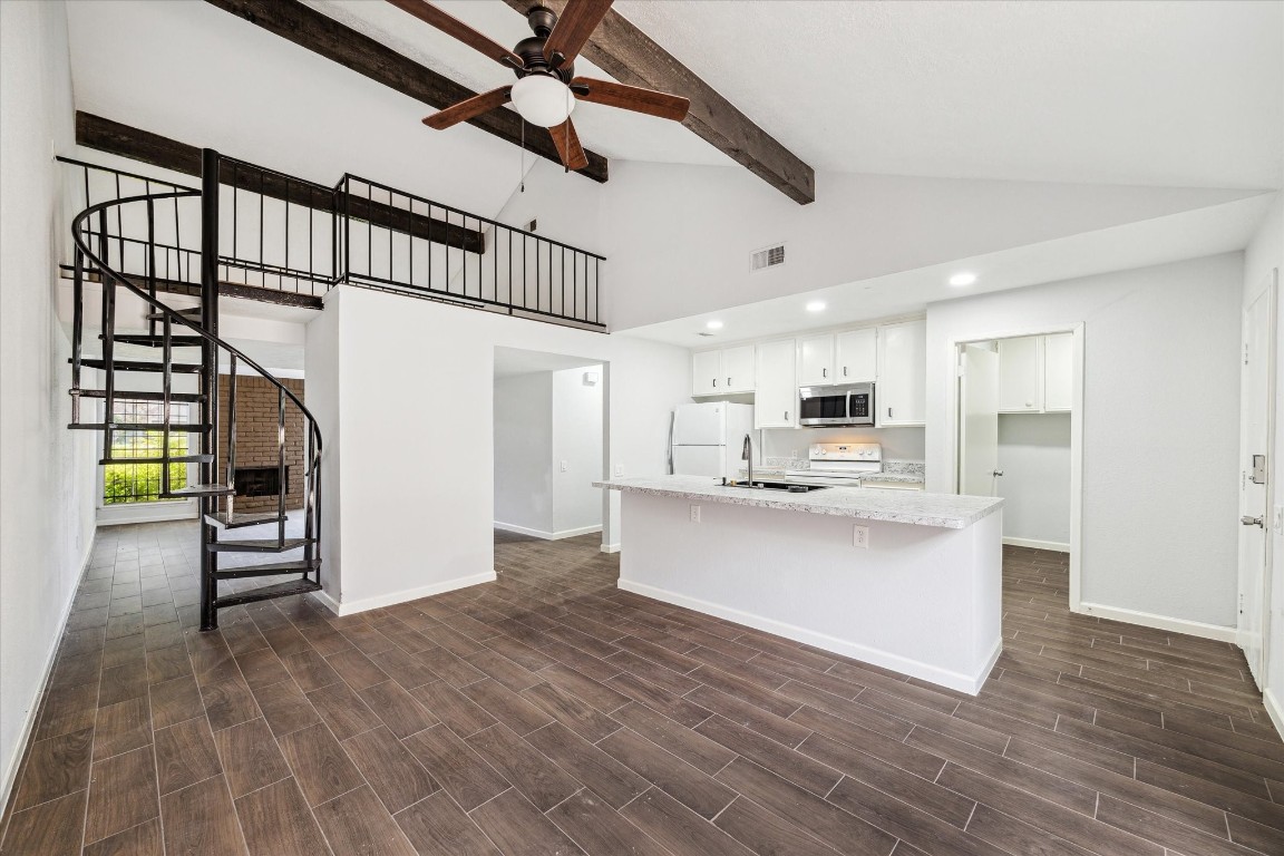 8628 Maplecrest Drive Houston, TX 77099 - Photo 1 of 10 a open kitchen with white cabinets and stainless steel appliances