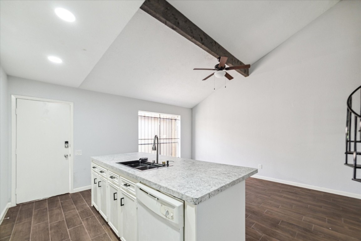 8628 Maplecrest Drive Houston, TX 77099 - Photo 4 of 10 a kitchen with a stove and a wooden floor