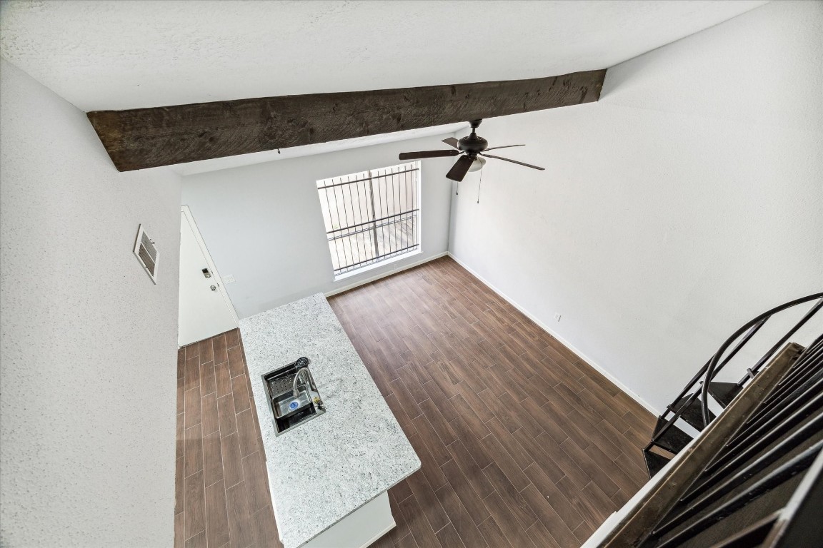 8628 Maplecrest Drive Houston, TX 77099 - Photo 8 of 10 a view of staircase with wooden floor