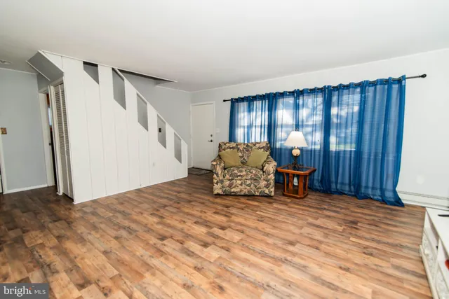 a spacious bedroom with a bed and a window