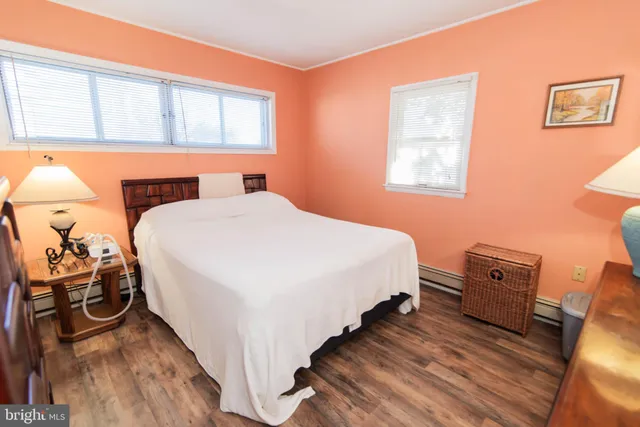 a bed room with a bed and a tv