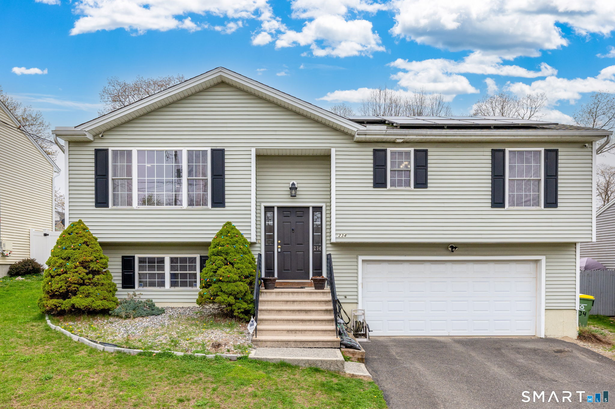 234 Traverse Street Waterbury, CT 06704 - Photo 1 of 38 a front view of a house with garden