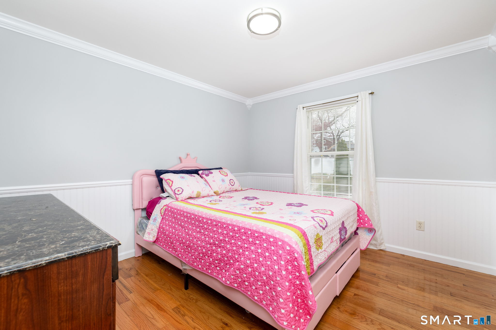 234 Traverse Street Waterbury, CT 06704 - Photo 15 of 38 a bedroom with a bed and wooden floor