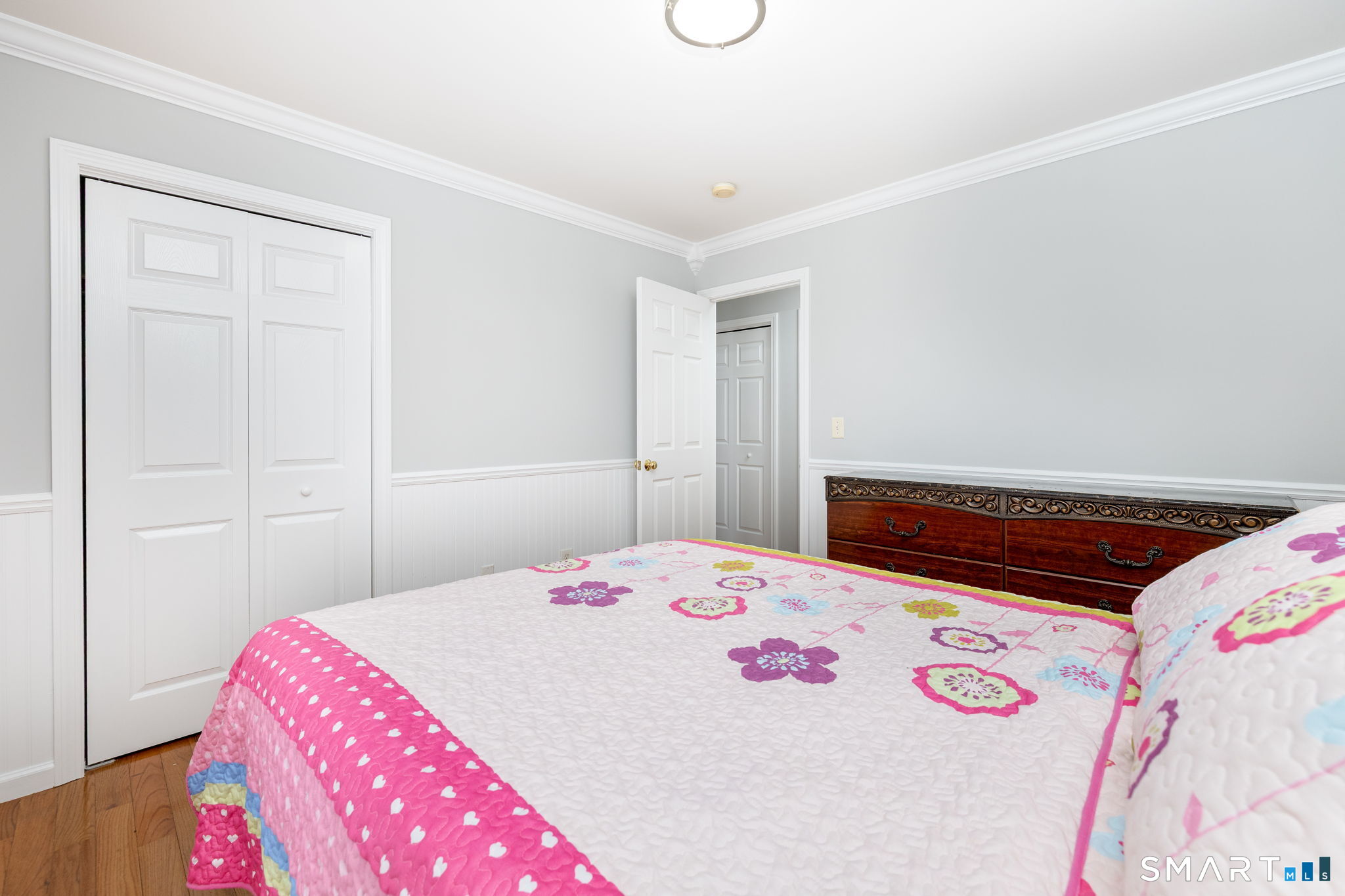 234 Traverse Street Waterbury, CT 06704 - Photo 16 of 38 a bedroom with a bed and a dresser