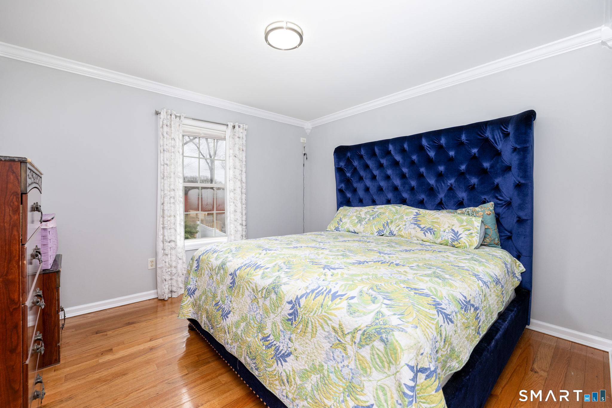 234 Traverse Street Waterbury, CT 06704 - Photo 19 of 38 a large bed sitting in a bedroom next to a window