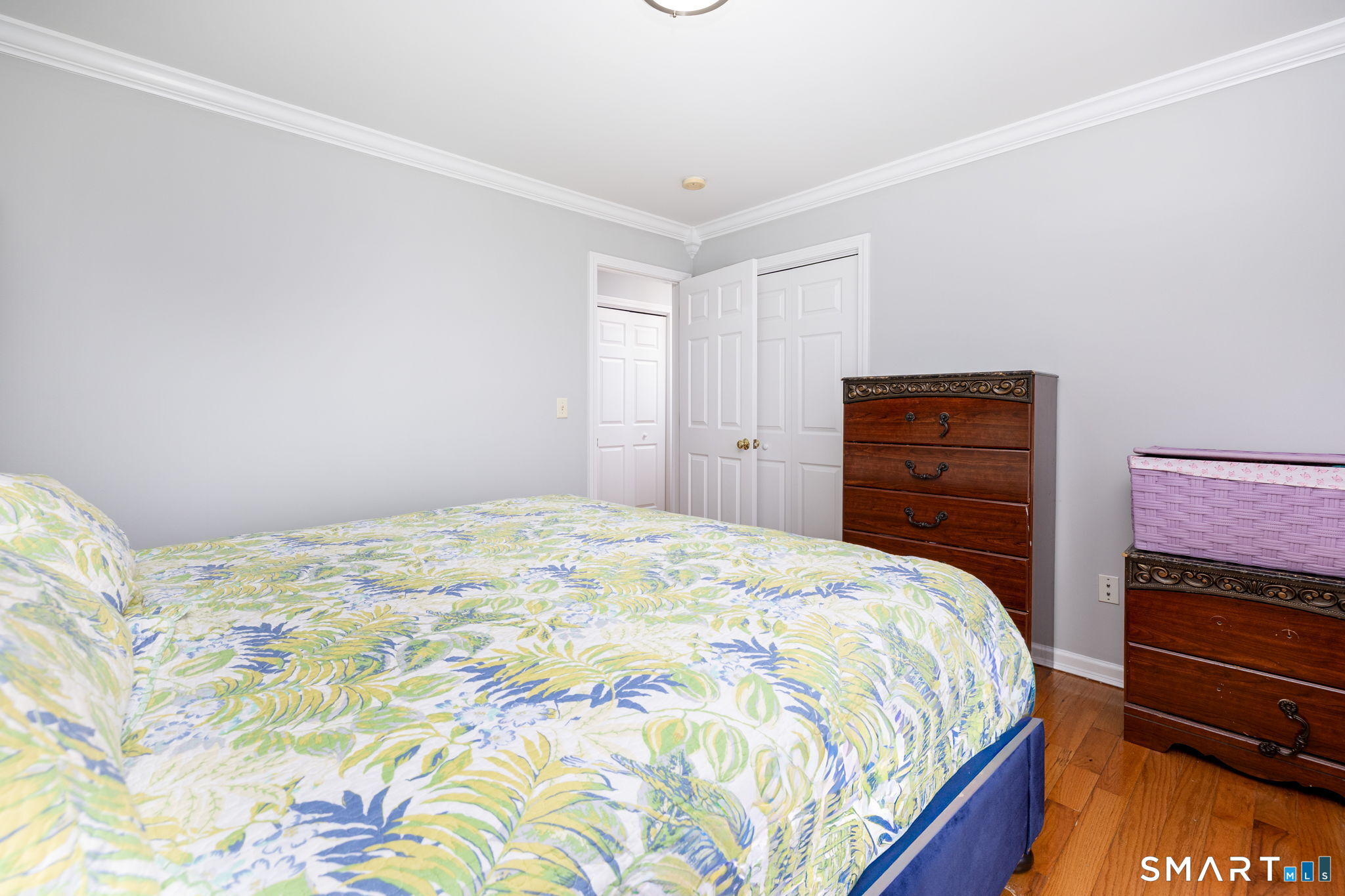 234 Traverse Street Waterbury, CT 06704 - Photo 20 of 38 a bedroom with a bed and a dresser