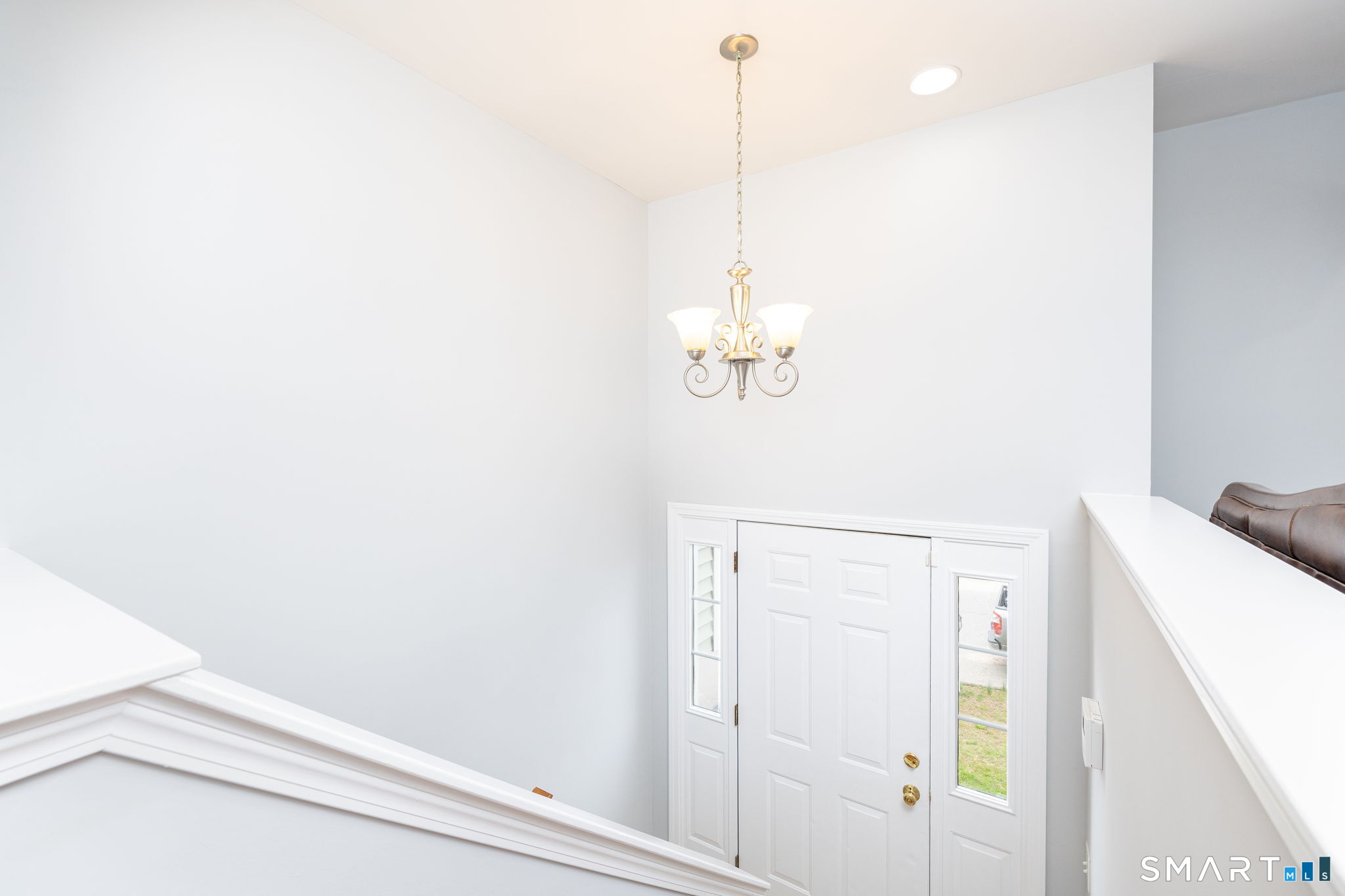 234 Traverse Street Waterbury, CT 06704 - Photo 21 of 38 a view of a room with a window and chandelier fan